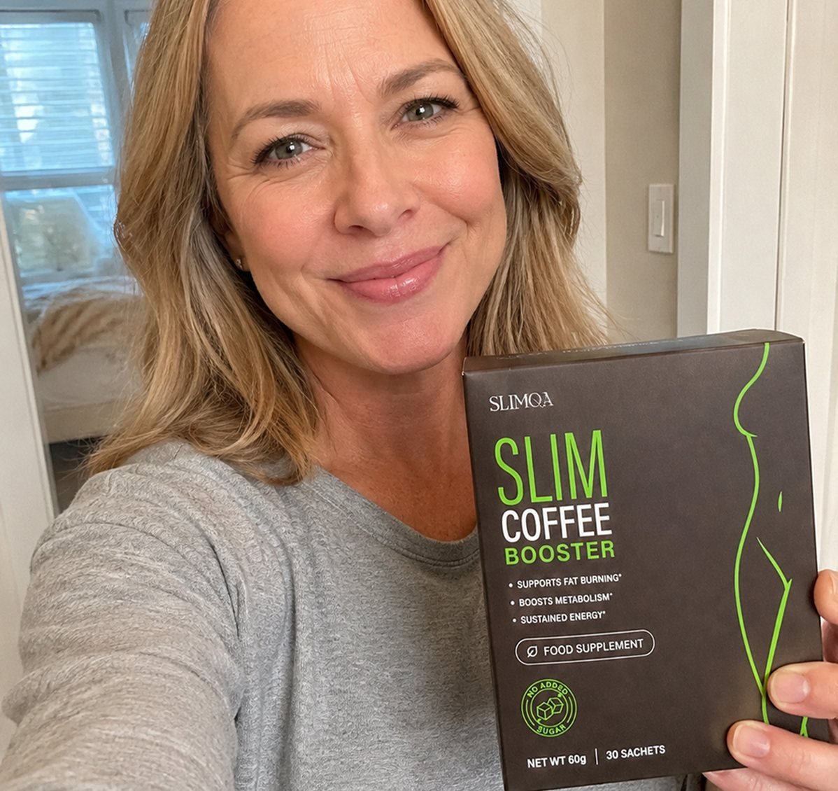 Woman holding SLIMQA Slim Coffee Booster